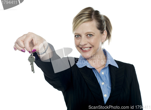 Image of Happy aged woman holding keys