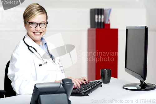 Image of Female physician using computer