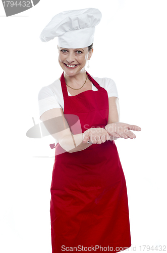 Image of Female chef with open palms