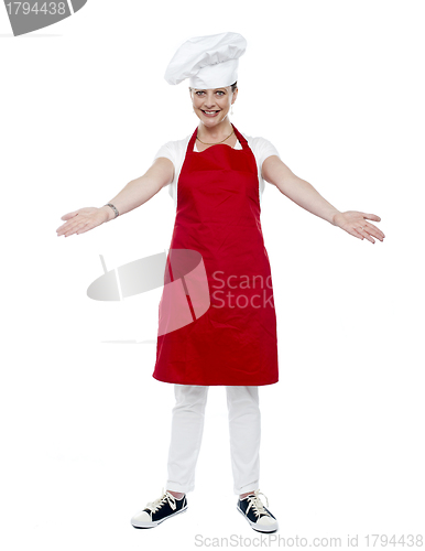Image of Full length portrait of chef posing in uniform