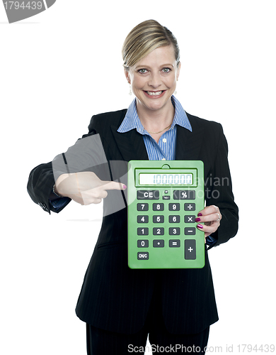 Image of Woman pointing at big calculator