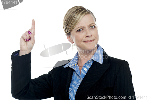 Image of Expressive businesswoman with pointing finger