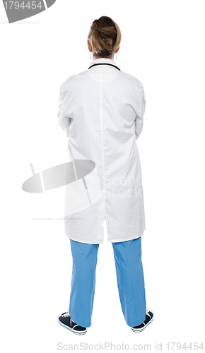Image of Back view of a female doctor. Full length shot