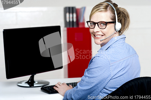 Image of Portrait of cheerful customer support executive