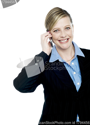 Image of Smiling businesswoman communicating