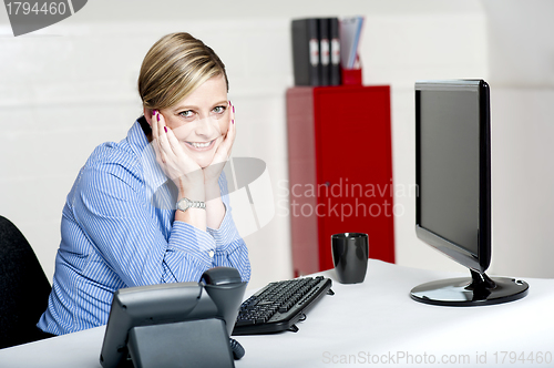 Image of Corporate woman posing with both hands on her chick