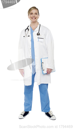 Image of Full length portrait of smiling senior female doctor