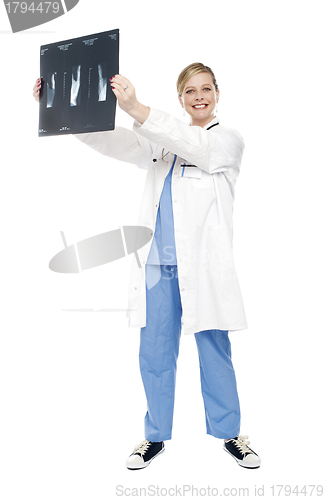 Image of Cheerful female doctor holding x-ray report