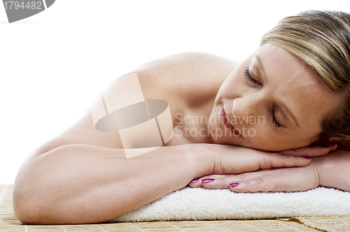 Image of Cropped image of woman relaxing at spa centre