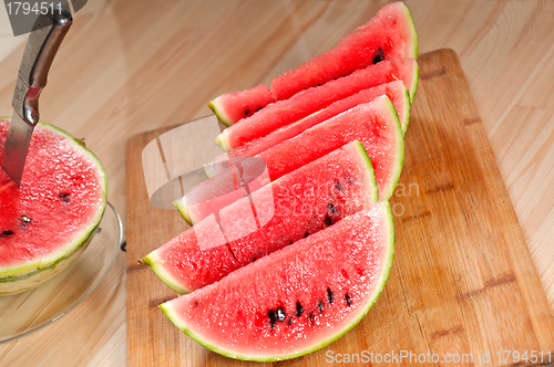 Image of fresh watermelon on a  wood table