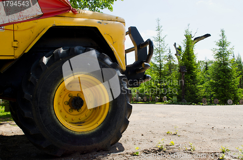 Image of freight car wheel closeup. Agricultural machinery 