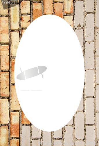 Image of Red and white brick wall and white oval in center 