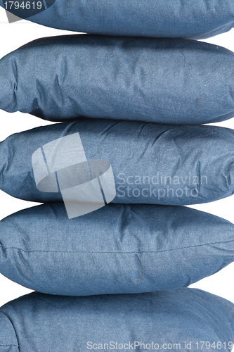 Image of stack of blue denim pillows