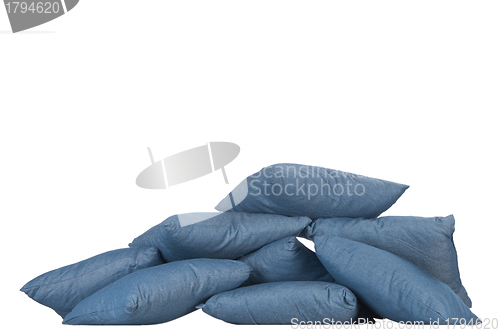 Image of stack of blue denim pillows