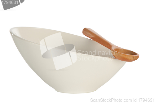 Image of white bowl and wood spoon