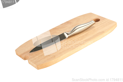 Image of table knife and wooden cutting board