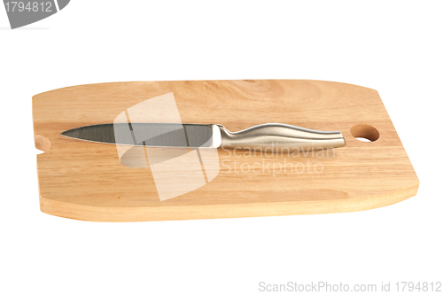 Image of table knife and wooden cutting board