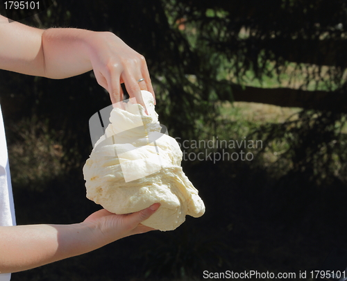 Image of making dough outdoors