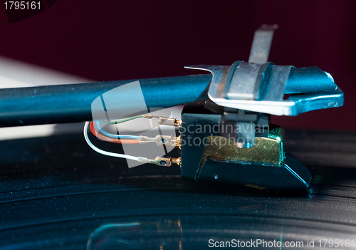 Image of Vinyl analog record player cartridge and LP