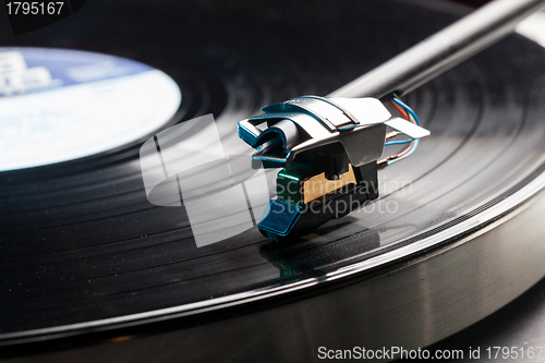 Image of Vinyl analog record player cartridge and LP