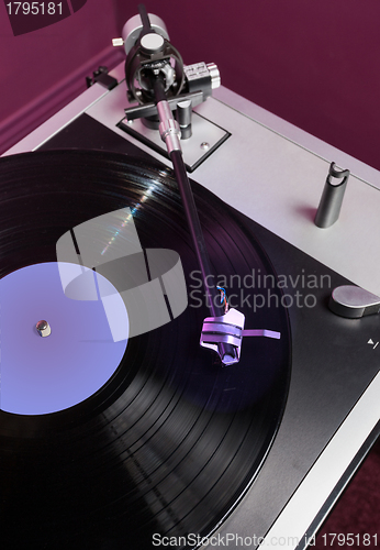 Image of Vinyl analog record player cartridge and LP