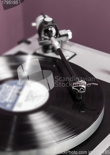 Image of Vinyl analog record player cartridge and LP