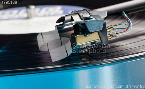 Image of Vinyl analog record player cartridge and LP