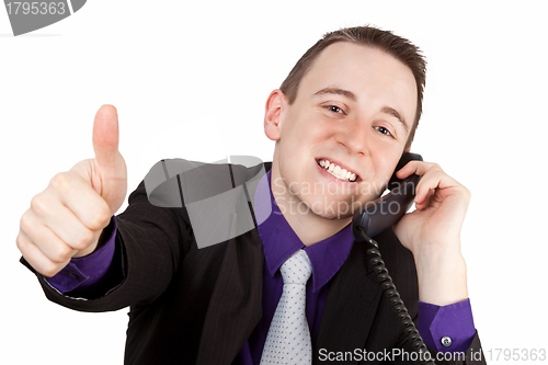 Image of Businessman showing thumbs up