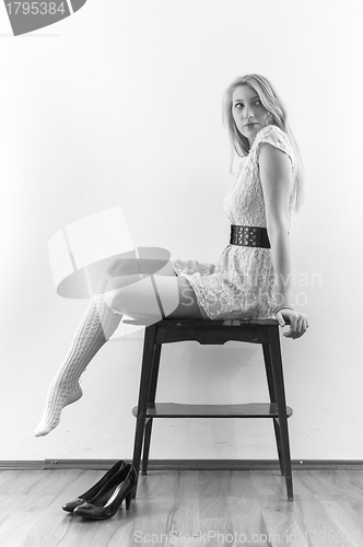 Image of Beautiful model sitting on table