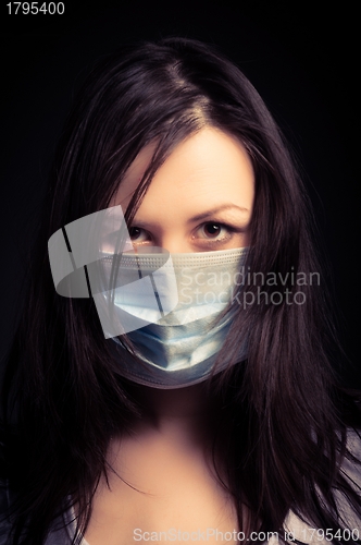 Image of Young woman in a protective mask