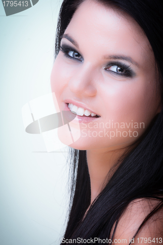 Image of Closeup of a cheerful young woman smiling