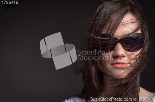 Image of Young woman with sunglasses