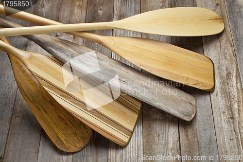 Image of wooden canoe paddles