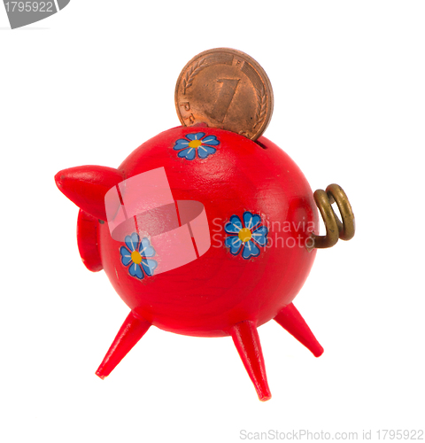 Image of Red piggybank with pfennig isolated on white 