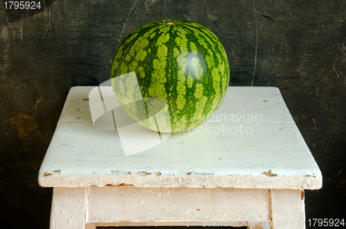 Image of Watermelon healthy food nutrition on white painted old dirty wooden table. 