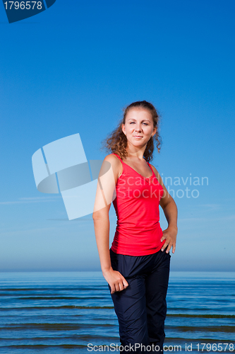 Image of Cute sport girl at the beach