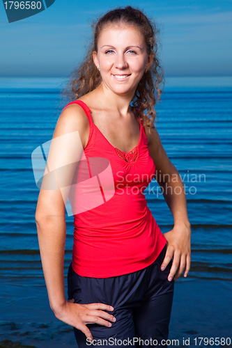 Image of Cute sport girl at the beach