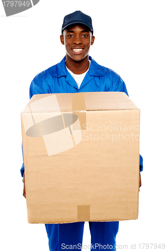 Image of Delivery guy holding big parcel and smiling