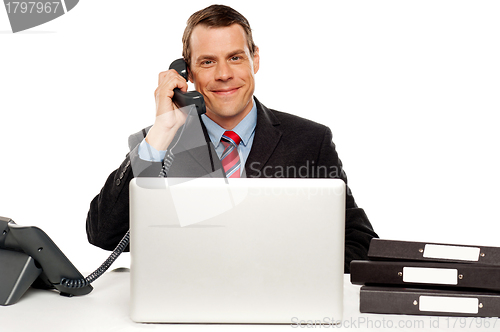 Image of Male executive communicating with client