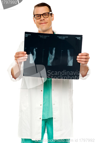 Image of Handsome young surgeon holding x-ray