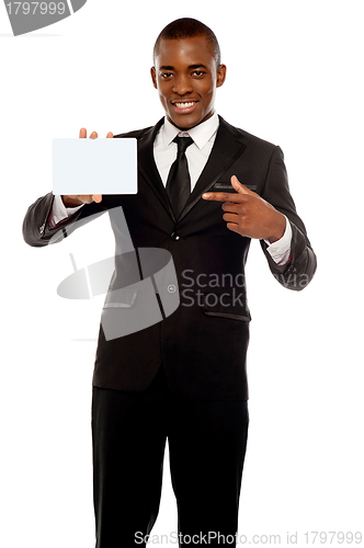 Image of Business promoter pointing at blank placard