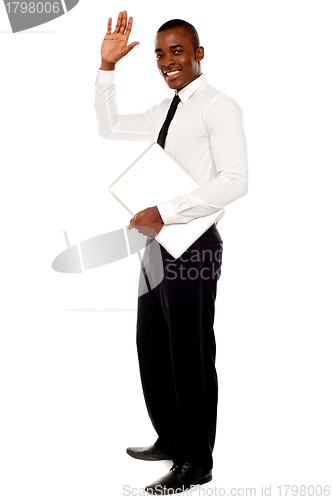 Image of Handsome african businessman waving hand