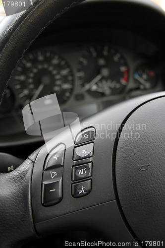 Image of steering wheel with light and sound control buttons