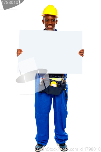 Image of African contractor showing blank billboard