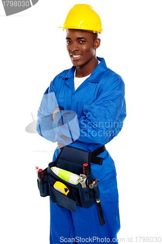 Image of Smiling african worker posing with arms crossed