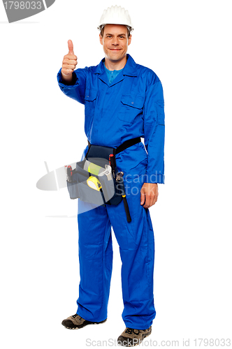 Image of Worker with tools bag showing thumbs up