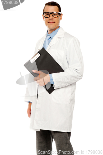 Image of Doctor in glasses carrying clipboard