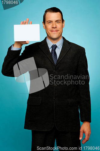 Image of Isolated corporate man holding blank placard