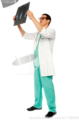 Image of Experienced surgeon looking at patient's x-ray