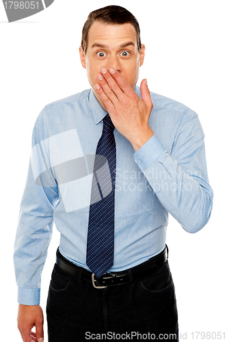 Image of Surprised businessman with hand on mouth